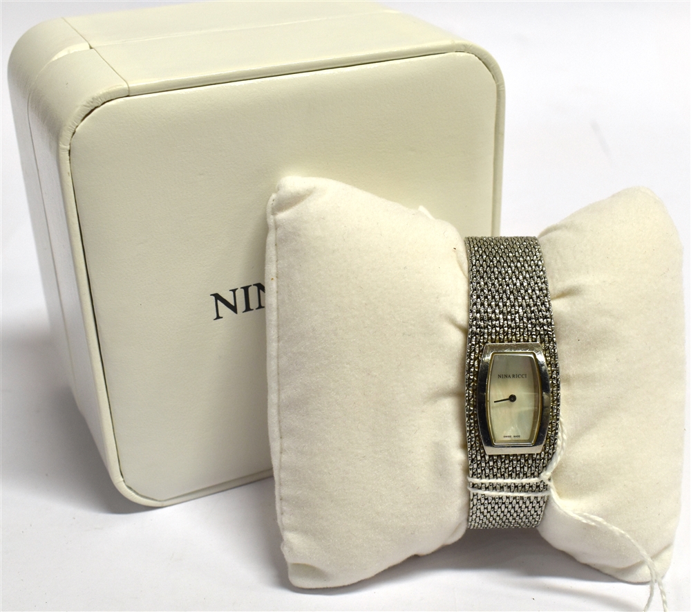 A LADIES NINA RICCI STEEL BRACELET WATCH The mother of pearl dial insert to a steel mesh bracelet,