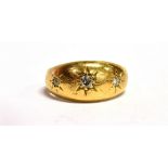 AN 18CT GOLD STAR SET DIAMOND GYPSY RING the shank hallmarked for Birmingham 1911, ring size I -