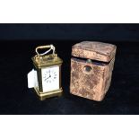 A MINATURE BRASS CARRIAGE CLOCK the unsigned enamel dial withRoman numerals, French movement