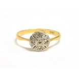 AN 18CT GOLD PLATINUM AND DIAMOND ACCENTED VINTAGE PLAQUE RING the circular plaque measuring approx.