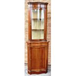 AN EDWARDIAN MAHOGANY SERPENTINE FRONT DISPLAY CABINET with inlaid decoration, 62cm wide 189cm