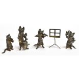 A FOUR PIECE SILVER CAT FIGURINE MUSICAL GROUP and music sheet stand, each cat figure playing a