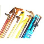 TEN ASSORTED WALKING STICKS many with animal or bird head grips, the longest 119cm long.