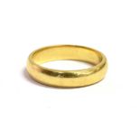 AN 18CT GOLD BAND RING the ring hallmarked for Birmingham 1979, ring size K, weight 3.8grams