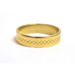 A 22CT GOLD, PATTERNED BAND RING the ring 0.5cm wide, hallmarked for Birmingham 1990, ring size P,