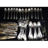 A LARGE COLLECTION OF ANTIQUE AND VINTAGE SILVER PLATED FLATWARE contained in a small suitcase, to