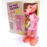 AN ILLCO TOY WIND-UP PINK PANTHER made in Hong Kong, with a clockwork mechanism (working), good
