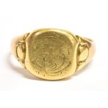 AN 18CT GOLD SIGNET RING The cushion shaped bezel with monogrammed cartouche, very worn 18CT stamp