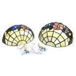 A GRADUATED PAIR OF TIFFANY STYLE LEADED AND STAINED GLASS WALL LIGHTS 31cm and 33cm wide