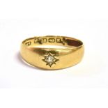 AN 18CT GOLD, DIAMOND STAR SET RING the tapered band hallmarked for Birmingham, possibly 1947, maker