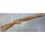 MILITARIA - A SECOND WORLD WAR HOME GUARD TRAINING DUMMY RIFLE of wood and cast metal