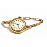 A VINTAGE 9CT GOLD CASED WRISTWATCH the watch on gilt expandable strap, side of case marked 375,