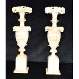 A LARGE PAIR OF CARVED ALABASTER VASES 61cm high Condition Report : generally good, with one