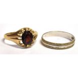 TWO DRESS RINGS a 9ct gold, garnet solitaire ring, faded hallmark to the shank, ring size T,