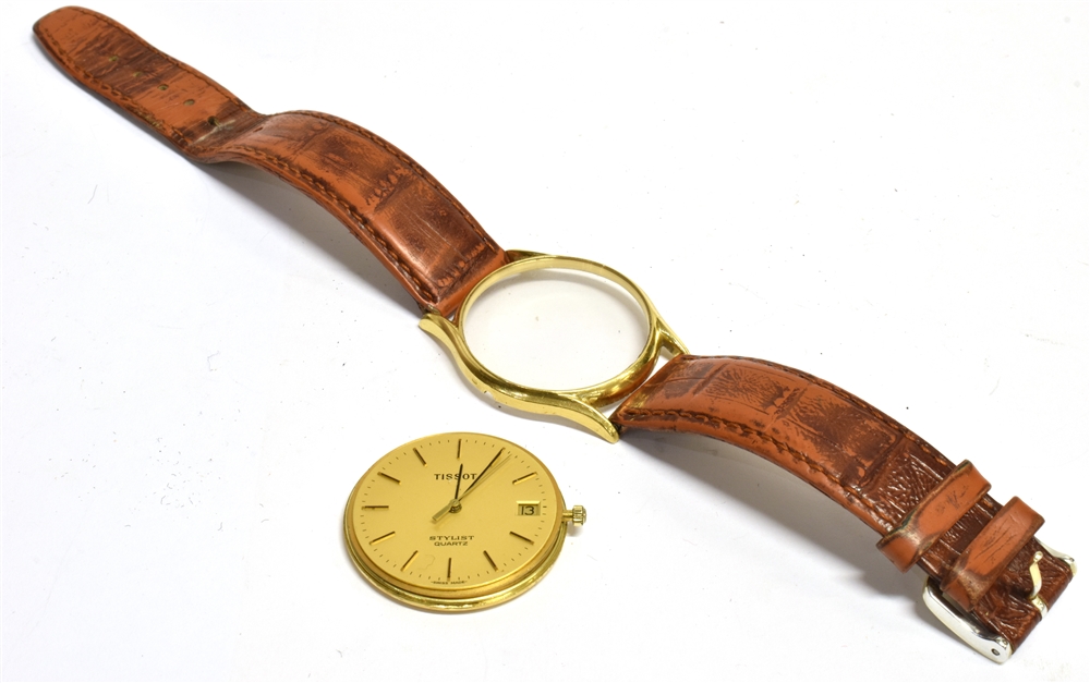 A GENTLEMANS 18KT GOLD CASED TISSOT STYLIST QUARTZ WATCH The gilt signed dial with day date gilt