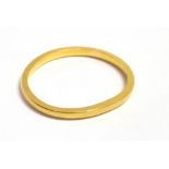 A 22CT GOLD BAND RING (bent shape), size M approx. weight 1.8grams, no condition report available