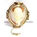 A CAMEO BROOCH the brooch in an unmarked yellow metal mount with openwork detail featuring a cameo