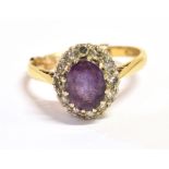 AN 18CT GOLD AND PURPLE ALMANDINE AND DIAMOND COCKTAIL RING the cocktail feature measuring 1.1 x