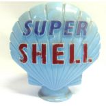 A SUPER SHELL PETROL PUMP GLOBE of pale blue glass with raised mid-blue and crimson lettering,
