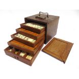 A MAH JONG SET containing 148 bone and bamboo tiles (including four blanks), in a hardwood five-