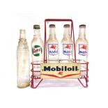 A MOBILOIL BOTTLE RACK 47.75cm high; together with five glass oil bottles, comprising those for