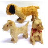THREE SOFT TOY DOGS circa 1940s-50s, the largest by Merrythought and 39cm long.