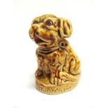 [SUFFRAGETTE INTEREST]. A POTTERY MODEL OF A SEATED DOG, INSCRIBED TO THE BASE 'VOTES FOR WOMEN'