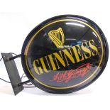 BREWERIANA - A GUINNESS ILLUMINATED WALL SIGN of double-sided right-angle type, complete with