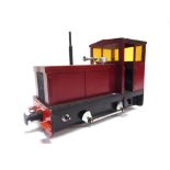 [32MM NARROW GAUGE]. A TURNER LOCO WORKS 0-4-0 DIESEL LOCOMOTIVE maroon livery, with an electric