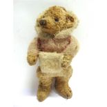 A PALE GOLD MOHAIR TEDDY BEAR circa 1930s, possibly by Chad Valley, wearing a smoking-style hat