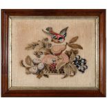 A 19TH CENTURY WOOLWORK PICTURE depicting a bird in flight above a bowl of fruit, 34.5cm x 43.5cm,