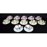 A SET OF TWELVE PARAGON CUPS AND SAUCERS with floral and gilt decoration, the saucers 14cm