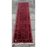 A RED GROUND RUNNER 80cm x 295cm