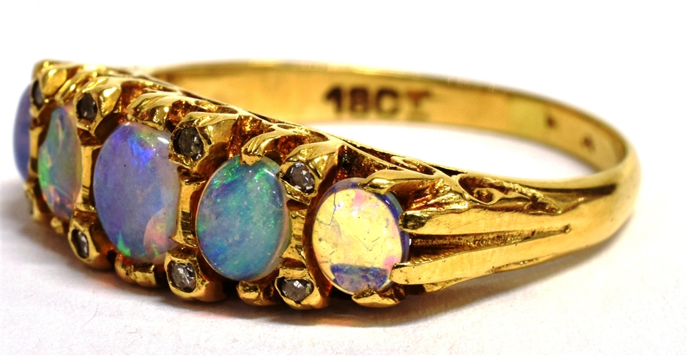 A STAMPED 18CT OPAL FIVE STONE BOAT RING The five oval graduated opals measuring approx 4mm - 5mm in - Image 3 of 5