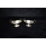 A MATCHED PAIR OF SILVER SAUCE BOATS the boats, twin handled, of plain form, hallmarked for London