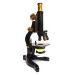 A MONOCULAR MICROSCOPE, W. WATSON & SONS, LONDON the japanned frame with lacquered brass fittings,