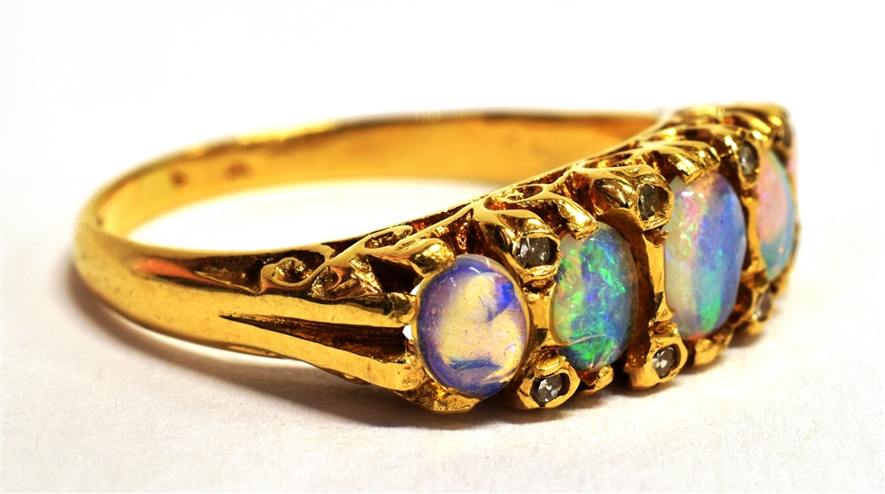 A STAMPED 18CT OPAL FIVE STONE BOAT RING The five oval graduated opals measuring approx 4mm - 5mm in - Image 2 of 5