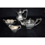 A FOUR PIECE SILVER TEA SET The set comprising of a teapot, coffee/hot water jug, twin handled sugar