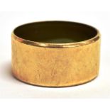 A 9CT GOLD WIDE BAND RING Width 1cm, weight 6g, N.B faded hallmark to the shank