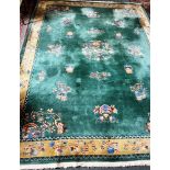 A GREEN GROUND CHINESE CARPET 235cm x 356cm