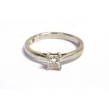 A PLATINUM PRINCESS CUT DIAMOND SOLITARIE RING The princess cut diamond measuring approx.