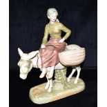 A ROYAL DUX FIGURAL TWIN POSY VASE modelled as a young girl riding a donkey on naturalistic oval