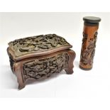 A CHINESE CARVED HARDWOOD LIDDED BOX of rectangular serpentine form, highly carved with dragons,