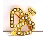 AN 18CT GOLD SEED PEARL 'KEY TO MY HEART' BROOCH The double entwined hearts set with seed pearls