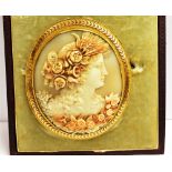 A CASED LATE 19TH/EARLY 20TH CENTURY LARGE CAMEO BROOCH The finely carved cameo with coloured floral