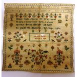 A MID 19TH CENTURY SAMPLER incorporating upper and lower case alphabets, a verse 'Beset with