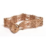 A 9CT ROSE GOLD HEART PADLOCK Fancy gate bracelet, width 1.2cm, length 19cm, hallmarked for