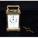 A BRASS CASED CARRIAGE CLOCK the enamel dial inscribed 'Charles Desprez Bristol', 11.5cm high with