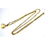 A YELLOW METAL LONG CHAIN AND CITRINE SPINNER The Long chain comprising of belcher and fancy links