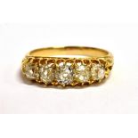 A STAMPED 18CT OLD CUT DIAMOND FIVE STONE BOAT RING five graduated diamonds measuring approx 3-4mm